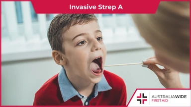 Young boy getting throat checked by doctor